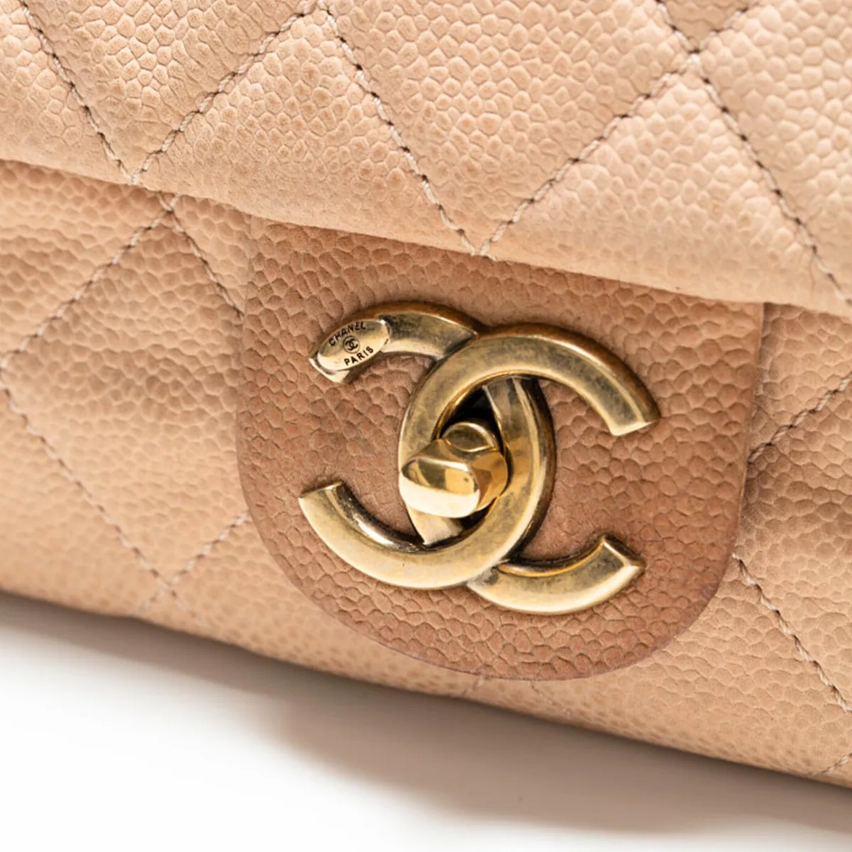 Sample photo 6, Detail Close-up: a close-up of the grained leather quilting and the CC turn-lock