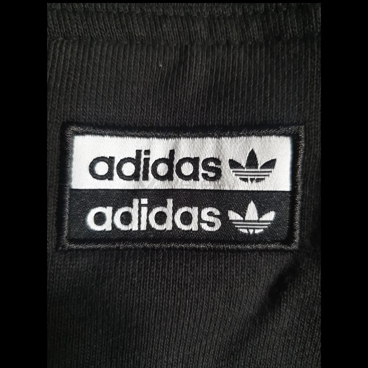 Sample photo 2, Material & Detail: the embroidered adidas logo patch on the hoodie