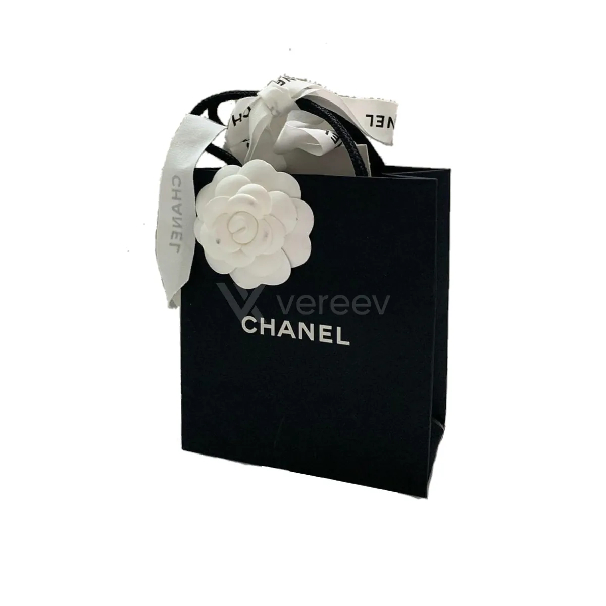 Sample photo 4, Packaging: a black Chanel shopping bag with a white camellia and ribbon