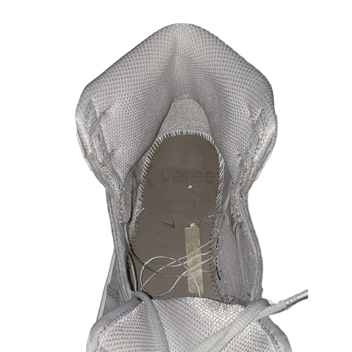 Sample photo 6, Inner Construction: the inside of a shoe with the insole removed, showing the stitching and board