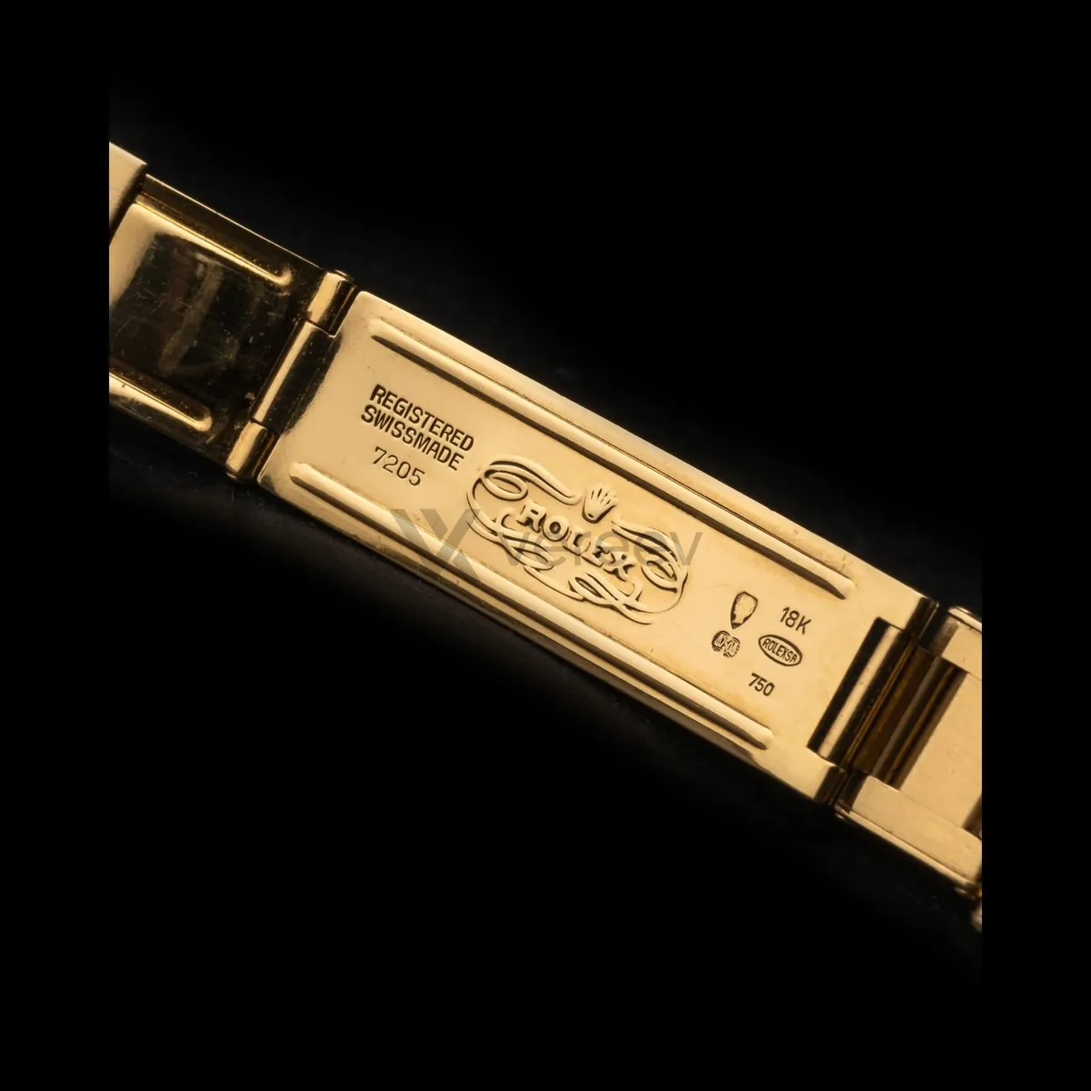 Sample photo 6, Bracelet / Strap: the inside of the bracelet clasp, stamped with the Rolex crown, REGISTERED SWISS MADE and 18K