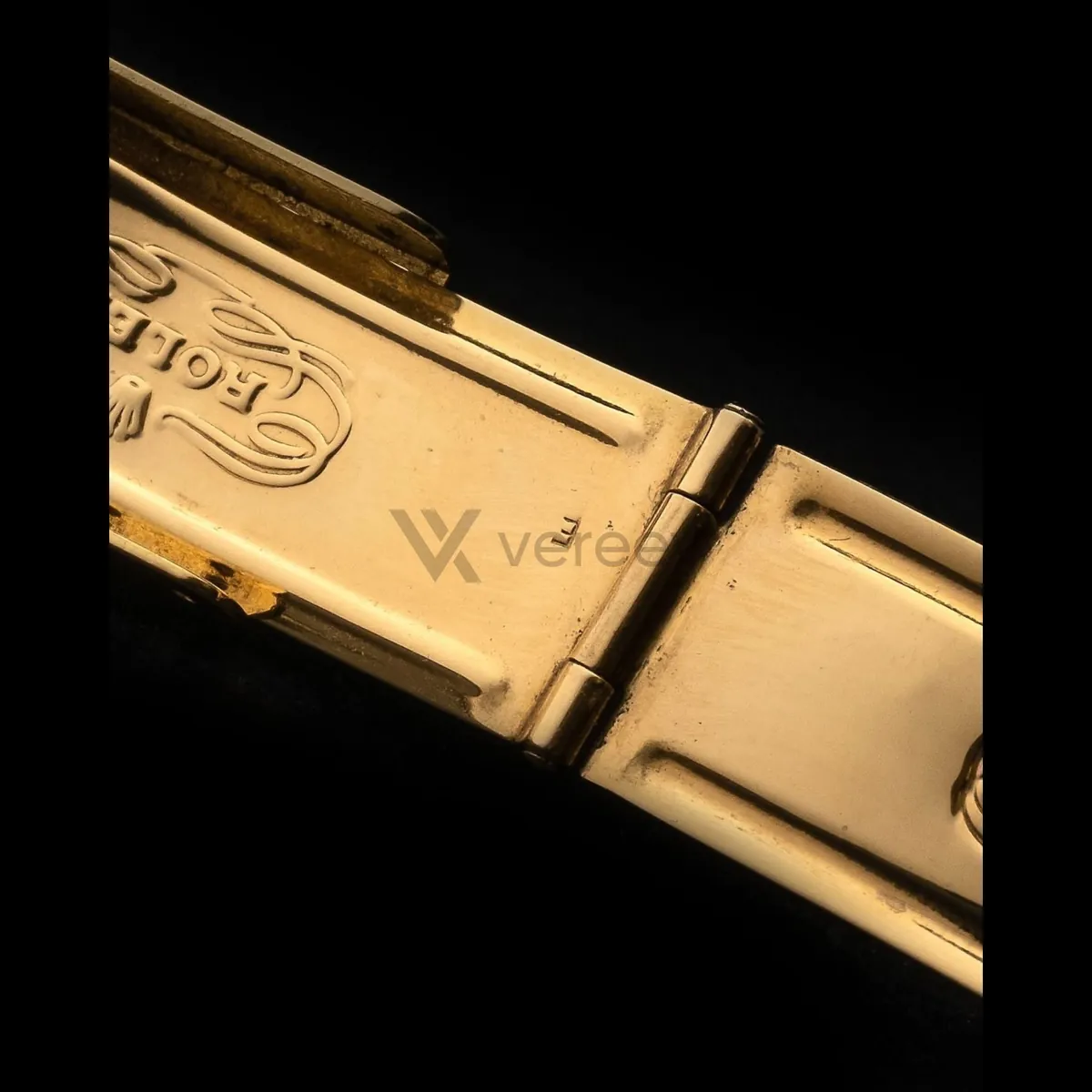 Sample photo 10, Watch Detail: a close-up of the clasp hinge and the engraved Rolex logo